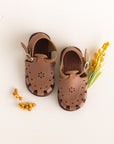 Adelisa & Co medium brown leather sandals for girls with floral detailing.
