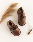 Dark brown leather boots for children. Unisex style.