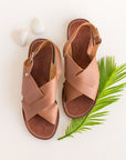 Cross strap, medium brown leather sandals for women.