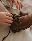 Dark brown leather boots for children. Unisex style.