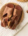 T-bar leather sandals with floral detailing for women.