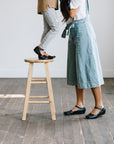 Adelisa & Co's handmade leather Cosecha Mary Janes for women in black with vintage style leaf detail.