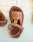 Adelisa & Co t-bar leather sandals for girls with floral detailing.