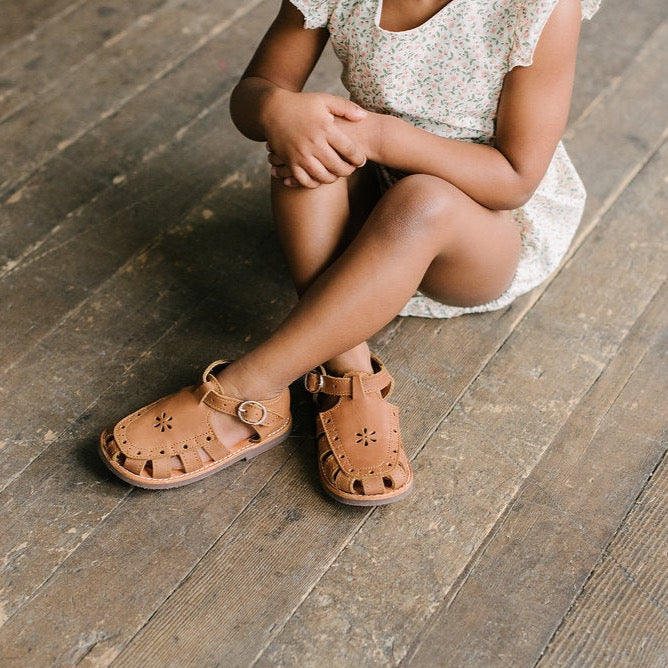 Adelisa &amp; Co medium brown leather sandals for girls with floral detailing.