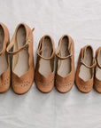 Adelisa & Co's handmade leather Cosecha Mary Janes for babies, kids and youth. These vintage style mary janes are crafted by artisans in Nicaragua and feature soft brown leather with a delicate leaf detail.