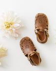 Adelisa & Co medium brown leather sandals for girls with floral detailing.