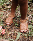 Adelisa & Co t-bar leather sandals for girls with floral detailing.