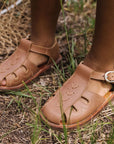Adelisa & Co medium brown leather sandals for children. Unisex style.