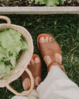 T-bar leather sandals with floral detailing for women.