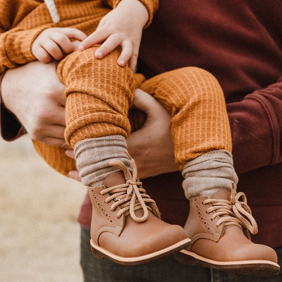 Adelisa &amp; Co Paseo leather boots for children in medium brown. These vintage style boots feature subtle handcrafted side detailing and come in a medium brown leather.