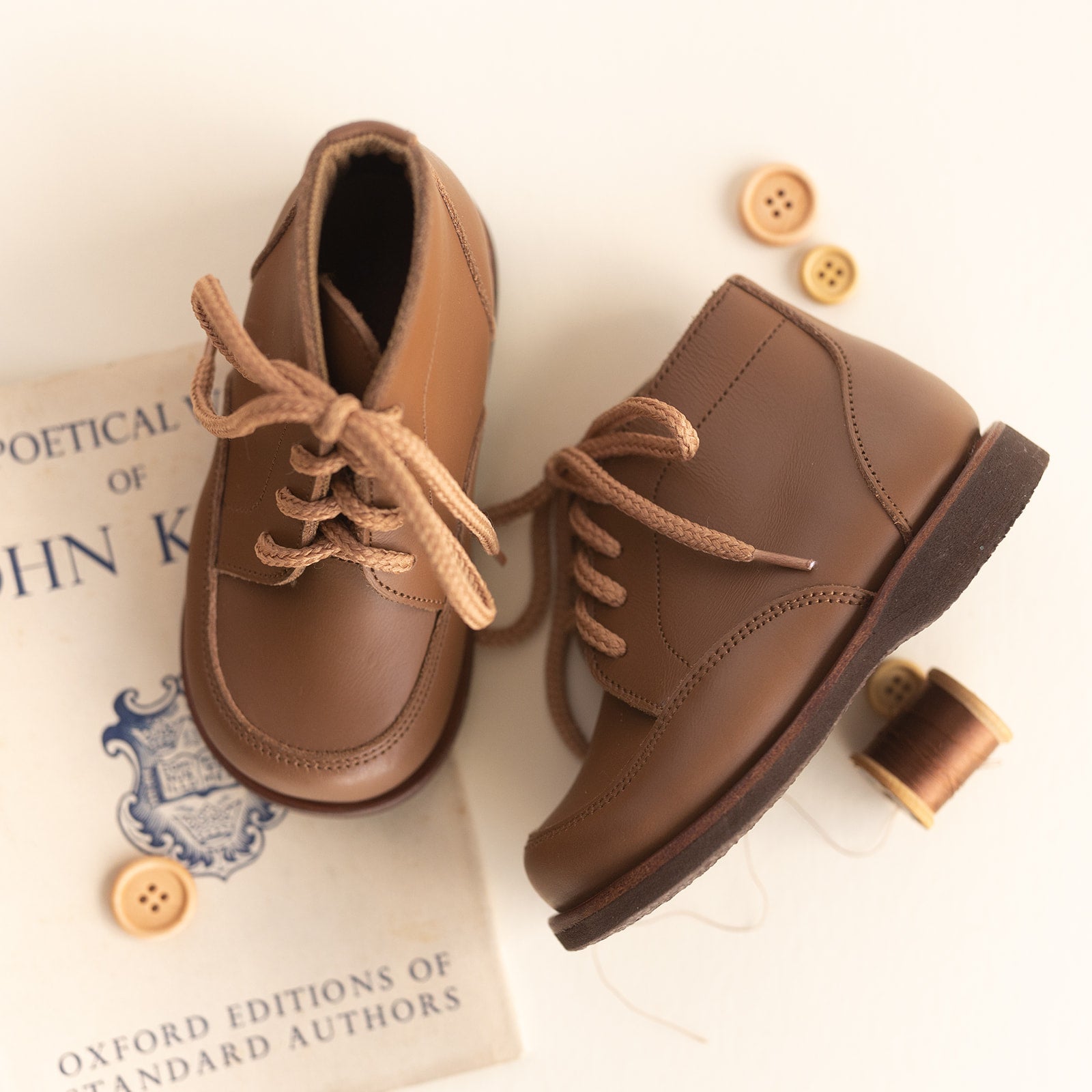 Adelisa & Co. Vintage style leather boots for children. Our Antigua leather boots come in a medium brown leather and feature a simplistic design with a round toe. Unisex style