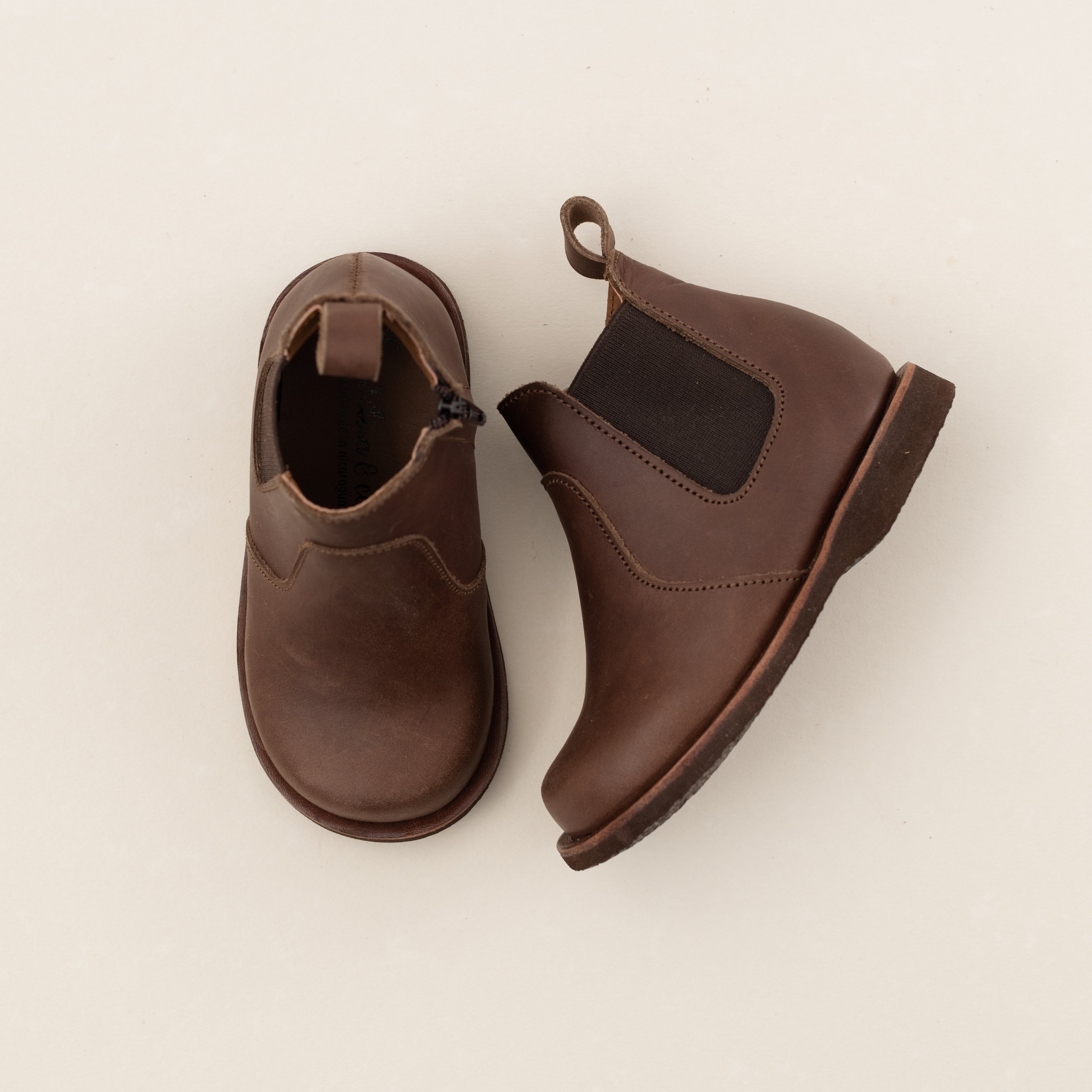 Dark brown leather Chelsea boots for children. Unisex style.