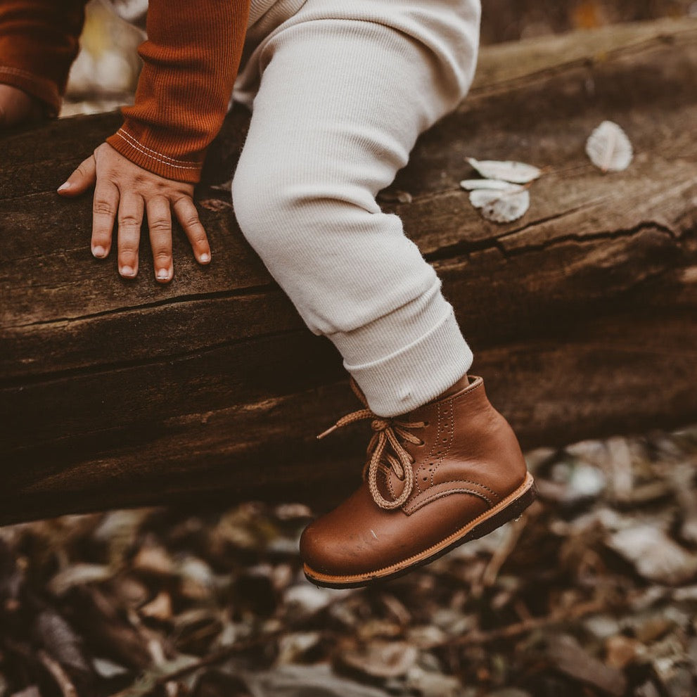 Adelisa &amp; Co Paseo leather boots for children in medium brown. These vintage style boots feature subtle handcrafted side detailing and come in a medium brown leather.