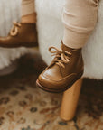 Adelisa & Co. Vintage style leather boots for children. Our Antigua leather boots come in a medium brown leather and feature a simplistic design with a round toe. Unisex style