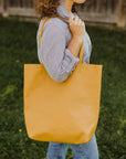 Adelisa & Co large mustard yellow leather tote for women.