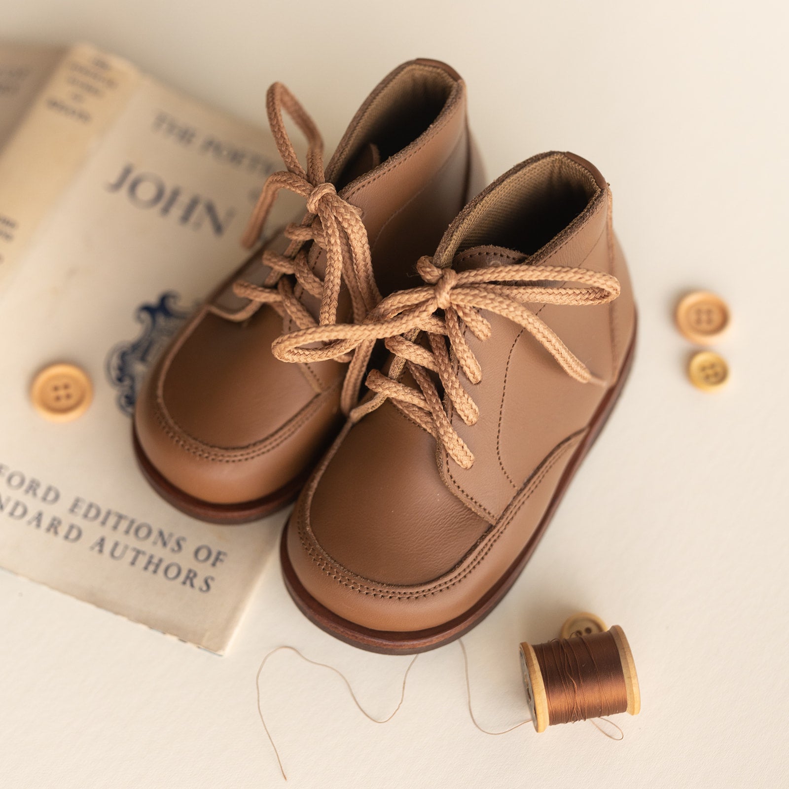 Adelisa &amp; Co. Vintage style leather boots for children. Our Antigua leather boots come in a medium brown leather and feature a simplistic design with a round toe. Unisex style