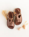 Adelisa & Co T-bar leather sandals for girls with floral detailing.