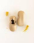 Beautiful beige leather soft sole moccasin style loafer shoes for babies.