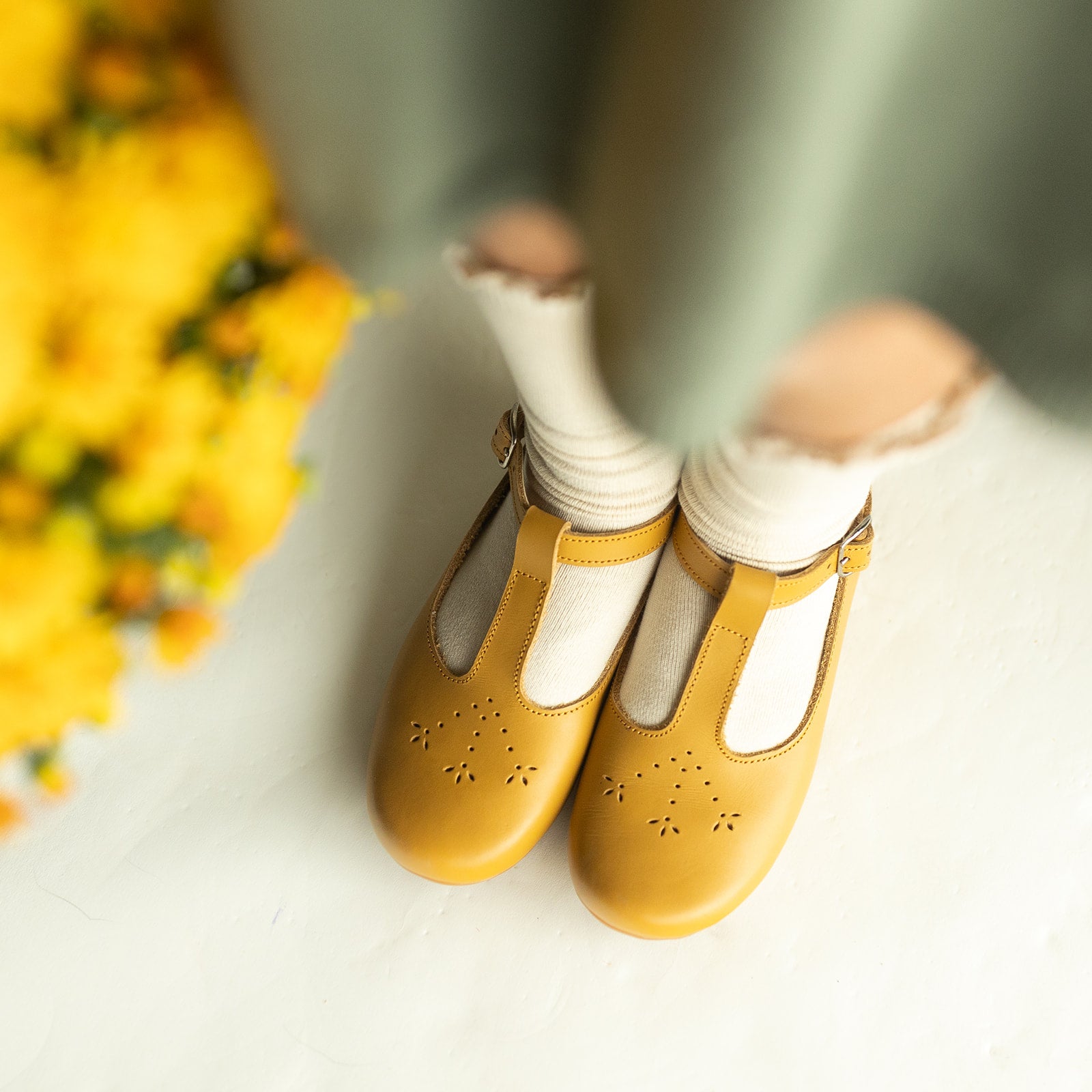 Adelisa & Co mustard yellow leather shoes for girls with floral detailing.