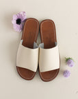 Cream leather slip on sandal for women.