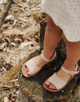 Adelisa & Co nude blush pink leather girl's sandals with scallop and floral detailing.
