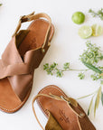 Cross strap, medium brown leather sandals for women.