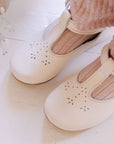 Cream leather Mary Jane shoes for girls.